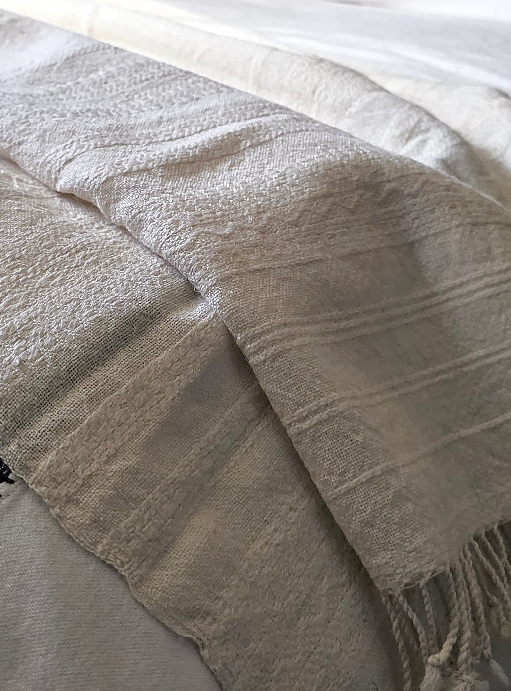 The Pastoralist Wool Throw in Ivory