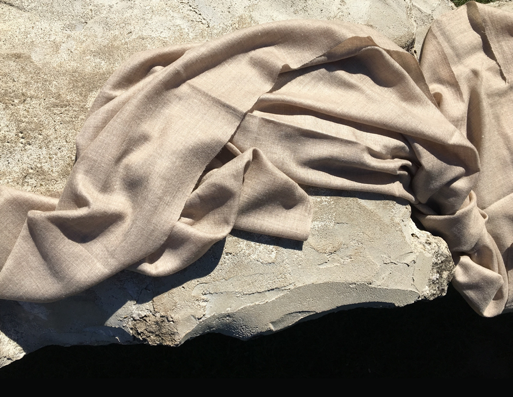 Textured fabric draped over a stone surface